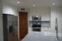 Side view remodeled kitchen island and upgraded appliances