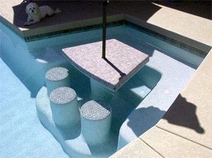 Picture of a custom built in swimming pool bar and table by True Blue Pools in Tempe AZ